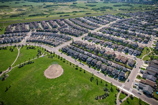 Captivating aerial shot of Stonebridge in Saskatoon, highlighting the harmonious blend of modern architecture and Saskatchewan's verdant surroundings.