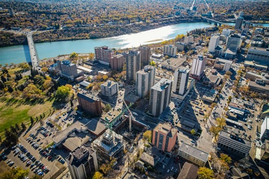 Aerial spectacle of downtown Saskatoon, revealing the city's architectural marvels, bustling streets, and the pulsating core of Saskatchewan's metropolis