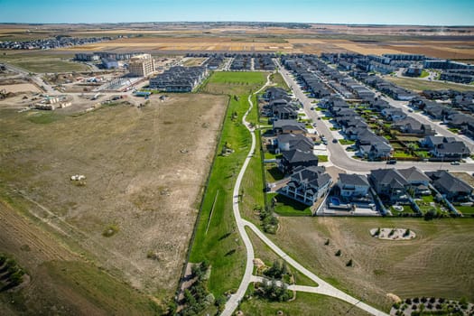 Stunning bird's-eye perspective of the Evergreen neighborhood in Saskatoon, showcasing the unique urban layout and the natural beauty of Saskatchewan's landscapes.