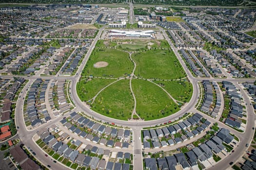 Captivating aerial shot of Stonebridge in Saskatoon, highlighting the harmonious blend of modern architecture and Saskatchewan's verdant surroundings.