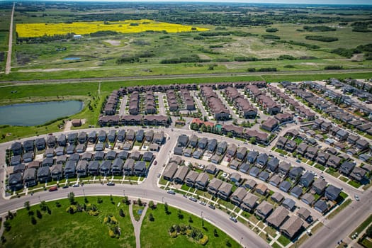 Captivating aerial shot of Stonebridge in Saskatoon, highlighting the harmonious blend of modern architecture and Saskatchewan's verdant surroundings.
