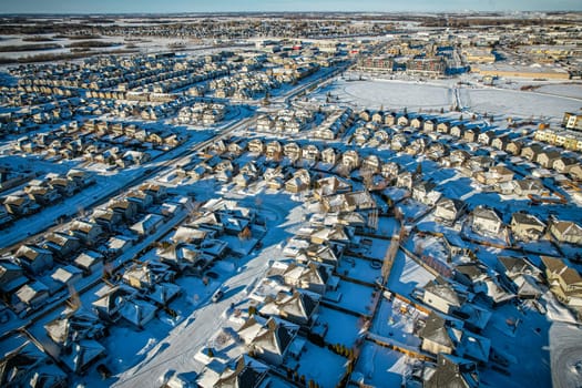Captivating aerial shot of Stonebridge in Saskatoon, highlighting the harmonious blend of modern architecture and Saskatchewan's verdant surroundings.