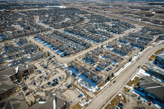 Captivating aerial shot of Stonebridge in Saskatoon, highlighting the harmonious blend of modern architecture and Saskatchewan's verdant surroundings.