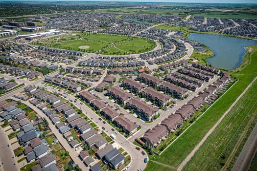 Captivating aerial shot of Stonebridge in Saskatoon, highlighting the harmonious blend of modern architecture and Saskatchewan's verdant surroundings.