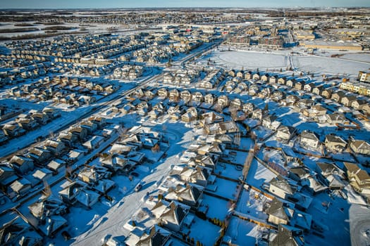 Captivating aerial shot of Stonebridge in Saskatoon, highlighting the harmonious blend of modern architecture and Saskatchewan's verdant surroundings.