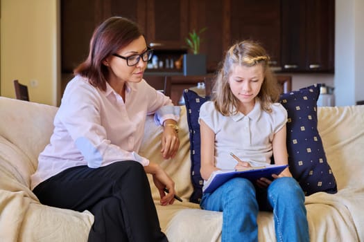 Individual therapy session for child girl with psychologist. Preteen girl talking to therapist. Education, mental health, psychology, pedagogue, psychotherapy, kids concept