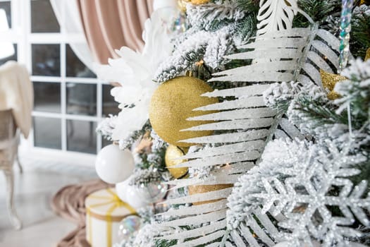 The interior of a room decorated for the holiday. Christmas New Year tree with garlands