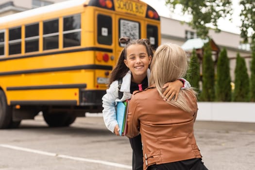 Outdoor portrait of a parent and children on the way to school.