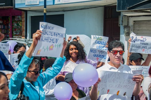 feminist demonstration against racism and femicide in latin america, men and women with banners held high protesting for equality. High quality photo