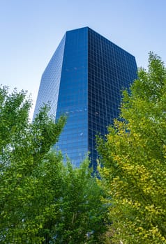Mirrored surface of modern skyscraper office building on Market St in downtown St Louis in Missouri