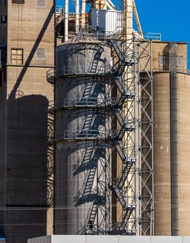 Pattern of steps up large grain processing and storage bins or silos in East St Louis in Illinois