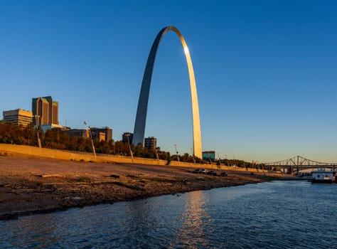 Low water levels in Mississippi river give unusual view of the Gateway arch towering over the riverbank at St Louis Missouri