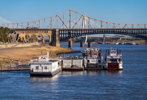 St Louis, MO - 21 October 2023: Low water levels in Mississippi river with casino riverboats docked by riverbank