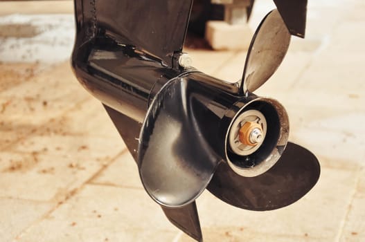 Motor propellers for motor yachts and boats close-up. The motors are mounted on the stern of the motor boat. Boat repair in dry dock. High quality photo