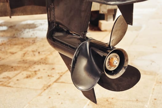 Motor propellers for motor yachts and boats close-up. The motors are mounted on the stern of the motor boat. Boat repair in dry dock. High quality photo