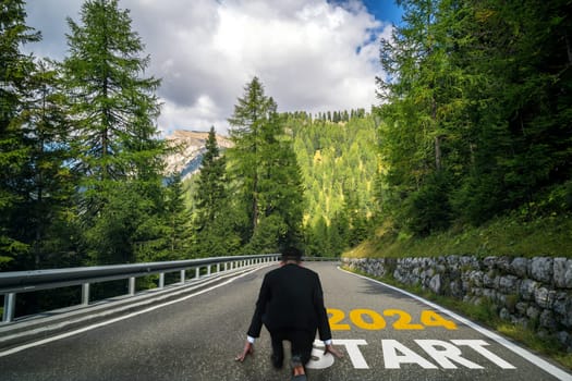 2024 New Year journey and future vision concept . Businessman traveling on highway road leading forward to happy new year celebration in beginning of 2024 for bliss and successful start .