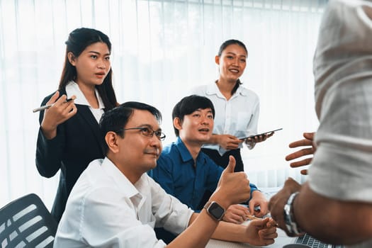 Excited and happy office worker employee celebrate after make successful strategic business marketing planning. Teamwork and positive attitude create productive and supportive workplace. Prudent