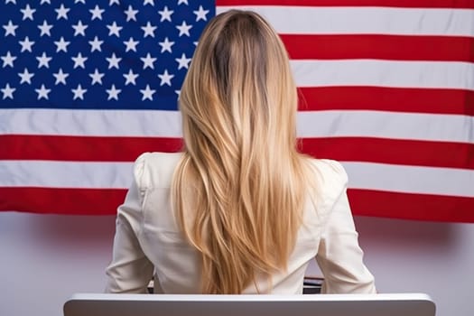 Blonde girl against the background of a blurred US flag.