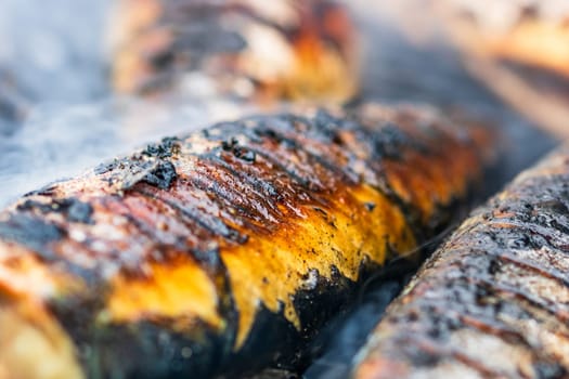 Grilled fish on charcoal grill. Fresh fish barbecue