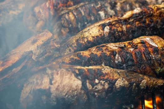 Grilled fish on charcoal grill. Fresh fish barbecue