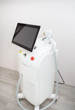 Professional laser hair removal machine. Professional cosmetology process, body epilation. Body care concept