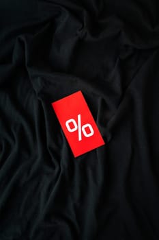 Black friday sale or discount banner. Red tag with percentage, discount on a black background. Modern minimal design with space for text. Template for promotion, advertising, internet, social networks