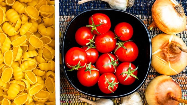 Beautiful tasty Italian pasta, tomatoes, onions and garlic for cooking pasta