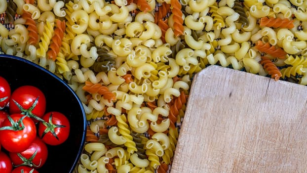 Beautiful tasty Italian pasta, tomatoes, onions and garlic for cooking pasta