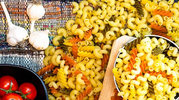 Beautiful tasty Italian pasta, tomatoes, onions and garlic for cooking pasta