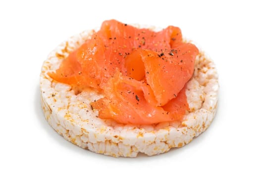 Tasty Rice Cake Sandwich with Fresh Salmon Slices Isolated on White. Easy Breakfast and Diet Food. Crispbread with Red Fish. Healthy Dietary Snack - Isolation