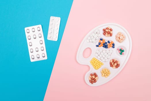 Global Pharmaceutical Industry and Medicinal Products - Different Colored Pills, Tablets and Capsules on White Art Palette with Pill Packages Lying on Split Blue and Pink Background, Flat Lay