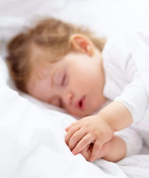 Hands, baby and kid sleeping on bed for calm break, peace and dreaming to relax at home. Tired, young child and cozy nap for newborn development, healthy childhood growth and rest in nursery room.