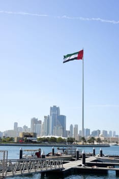 SHARJAH, UAE - February 14, 2023: Flag of the United Arab Emirates in Sharjah on the coastline