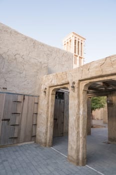 Narrow streets that create shade on a hot day in the old city of Dubai Creek and Bur district. Travel destinations and heritage village.