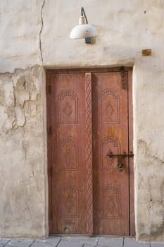 Arabic style carved wooden doors in Al Fahidi Historical District, Deira, Dubai, United Arab Emirates