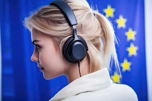 A young girl wearing headphones against the background of the European Union flag.