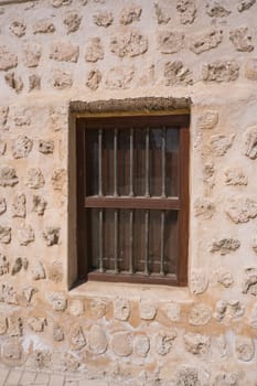 Traditional stone, coral and adobe wall in Sharjah emirate in the United Arab Emirates. Such hand plastered walls were made for centuries in the Arabian Gulf with materials from the desert and sea