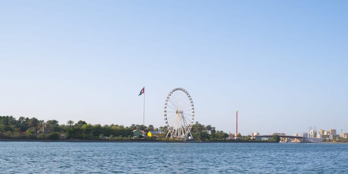 Sharjah cityscape with UAE flag