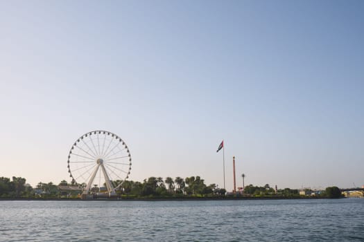 Sharjah cityscape with UAE flag