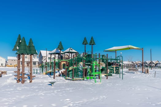 Experience the winter magic of Bear Paw Park in Saskatoon. This image captures the park's snowy landscape, frost-covered trees, and the serene beauty of a winter's day in the city.