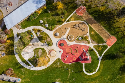 Kinsmen Park in Saskatoon, a hub of family fun. This image captures the park's vibrant play areas, scenic picnic spots, and the lively atmosphere, making it a cherished community destination.
