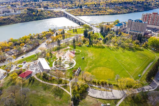 Kinsmen Park in Saskatoon, a hub of family fun. This image captures the park's vibrant play areas, scenic picnic spots, and the lively atmosphere, making it a cherished community destination.