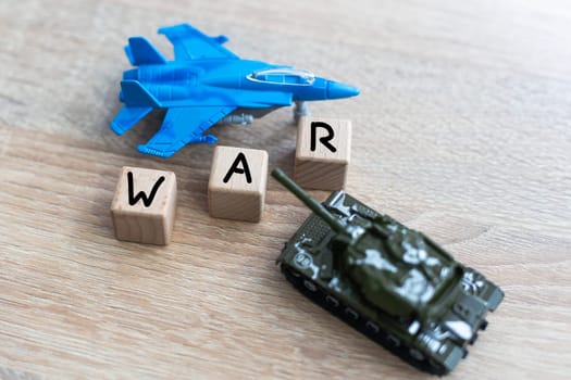 The image shows models of tanks and fighter jets on a white background, close up. High quality photo
