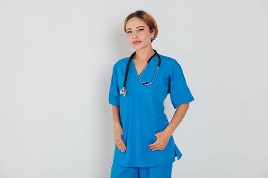 a female doctor in blue suit with phonendoscope stethoscope in hospital hospital