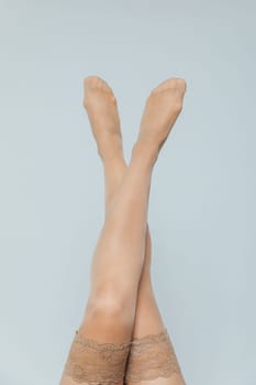 women's slender legs in beige stockings