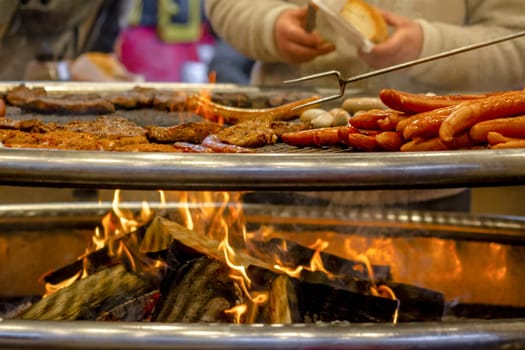 Grilling sausages on barbecue grill. Selective focus. High quality photo