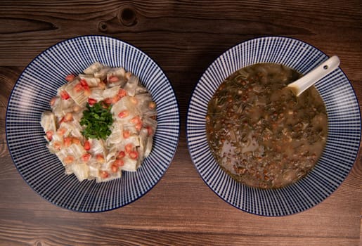 LEBANESE RECIPE FOR CHARD SOUP, LENTILS WITH LEMON, ADAS BI HAMOUD AND CHARD CHOPS, SESAME CREAM, TAHINI, POMEGRANATE SEEDS. High quality photo