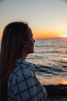 portrait of woman with her eyes closed by the sea in nature