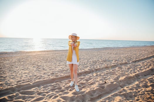 woman walks by the sea along the shore walk relaxing on the beach