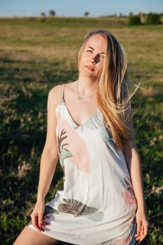 a walk blonde woman in nature on the field travel